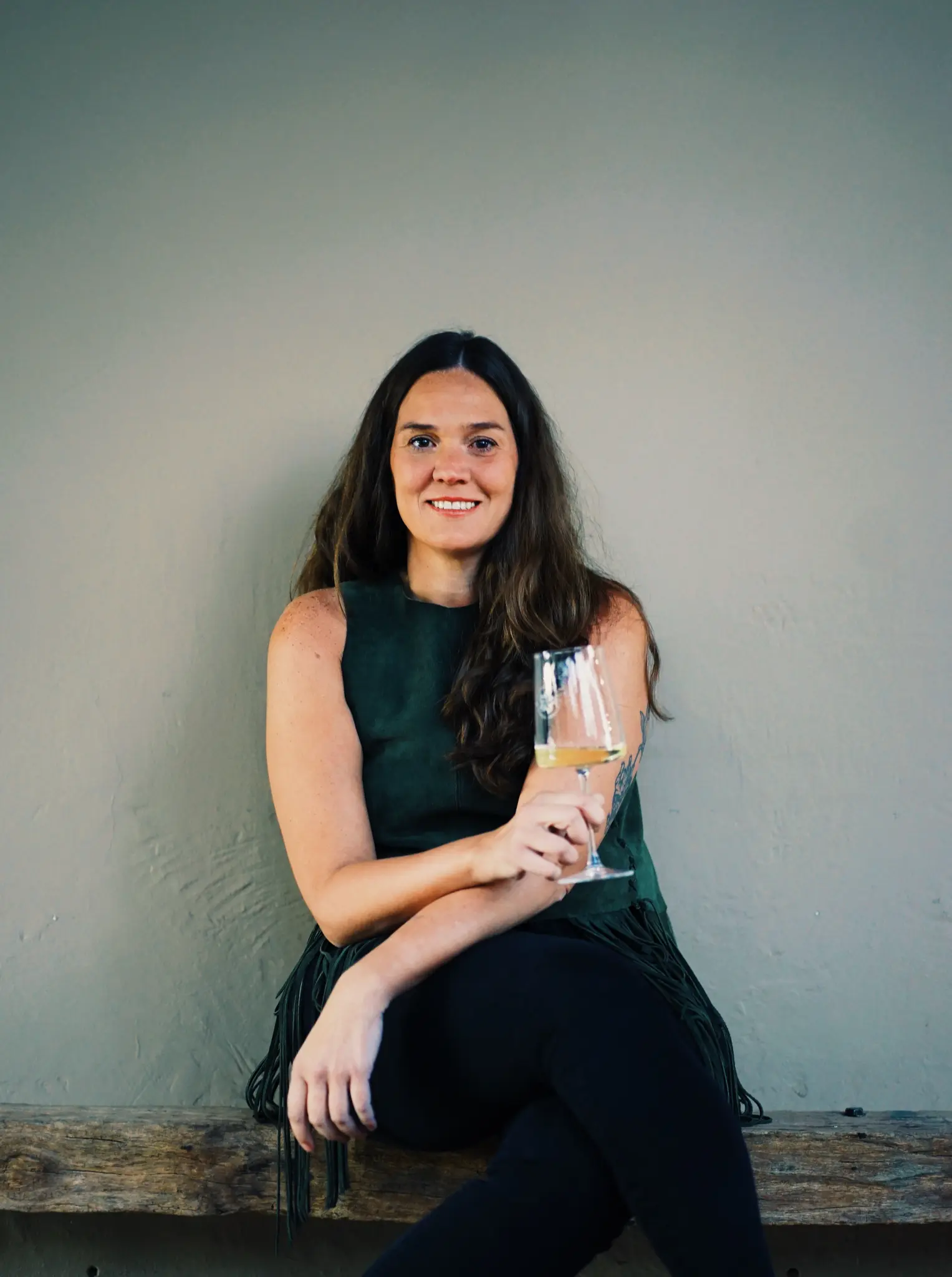 Martino Wines winemaker holding a glass of wine